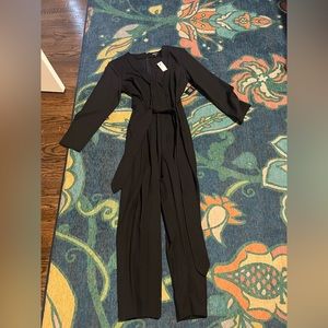 NWT black jumpsuit with belt.
